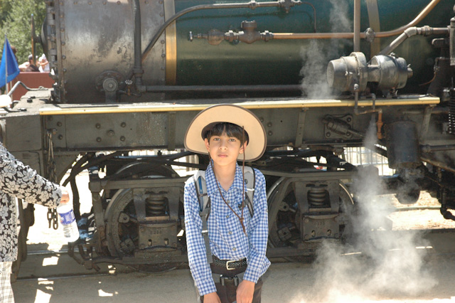Adi in front of a steam locomotive